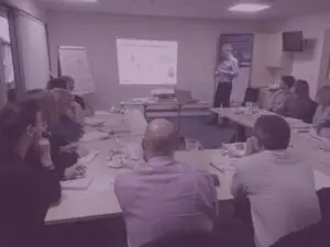 Dave presenting at at DBT conference with purple overlay