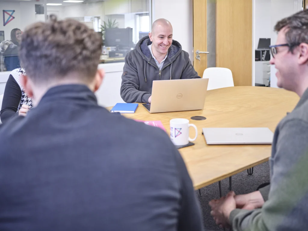Chris and Tom C in main meeting room at office